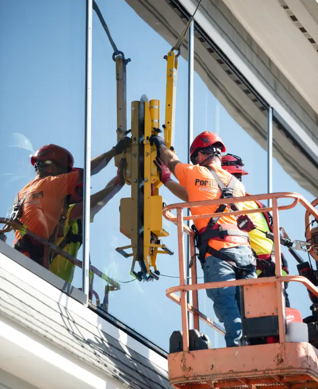 Portland Glass Associates outside of a building working on windows.