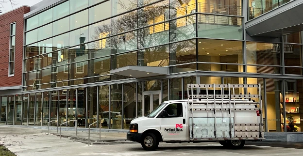 Portland Glass van outside of building.